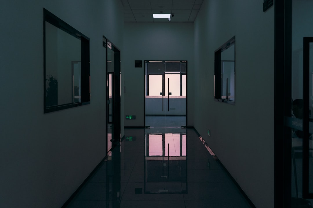 dark-modern-hallway-with-reflective-floor-and-windows-g8edtmfz138
